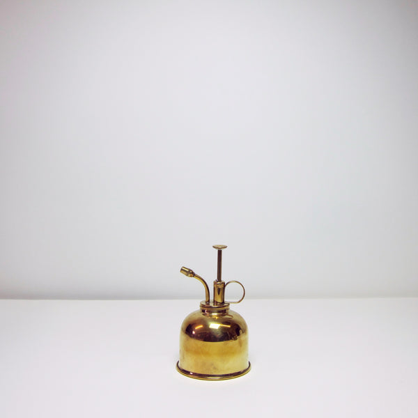 Polished brass spray can