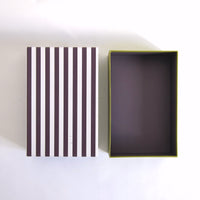 Black striped box with green base