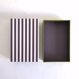 Black striped box with green base
