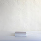 Black striped box with green base