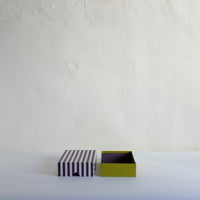 Black striped box with green base