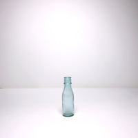 Small blue glass milk bottle