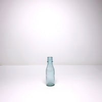 Small blue glass milk bottle