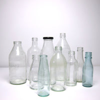 Small clear glass milk bottle