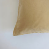 Pale yellow velvet cushion
