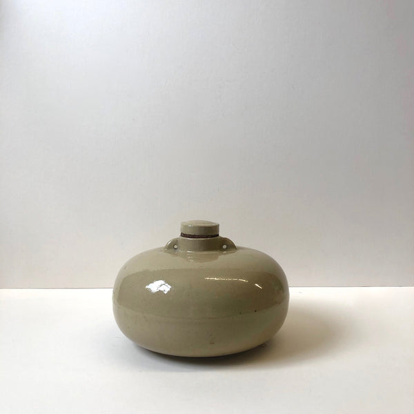 Short round clay bottle