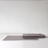 Grey placemat with fine stitch detail