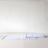 White cotton placemat with blue detail