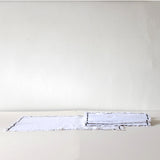 White cotton placemat with blue detail
