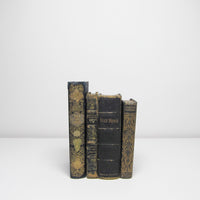 Four vintage black books