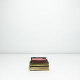 Four small vintage black books