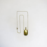 Gold bottle on chain