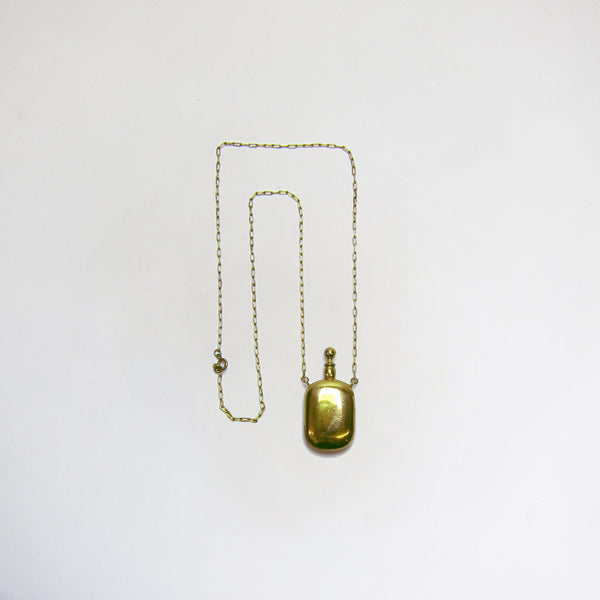 Gold bottle on chain