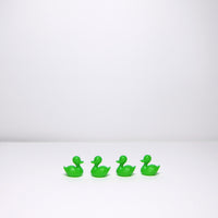 Four green plastic ducks