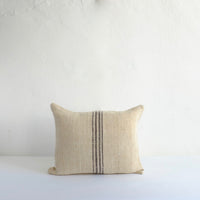Heavy cushion with thin black stripes