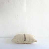 Heavy cushion with thin black stripes