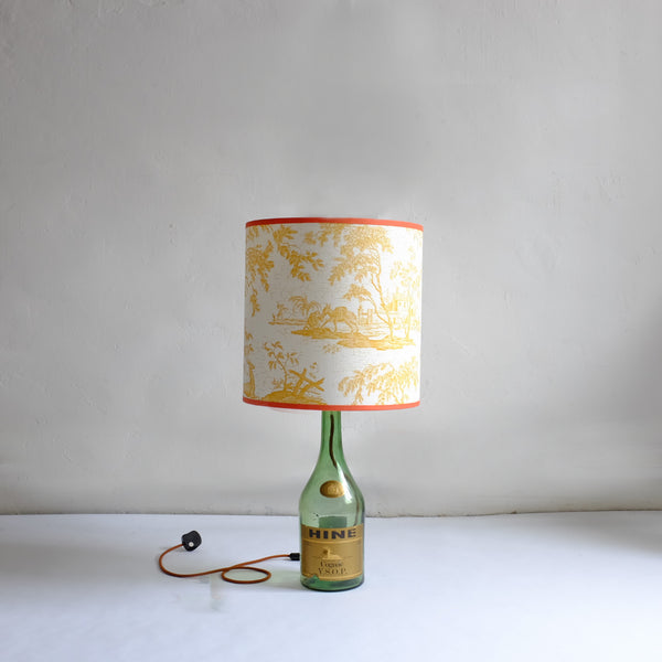 Green bottle lamp with yellow toile shade