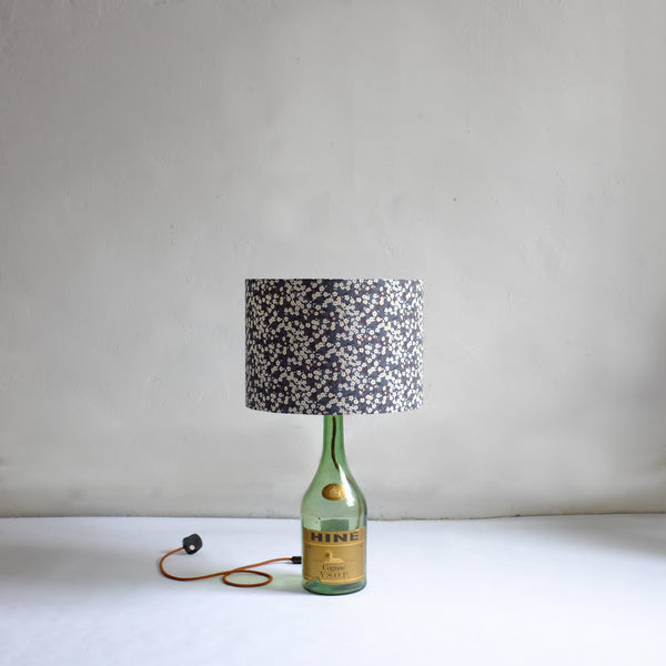 Tall green bottle lamp with floral shade