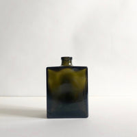 Square black glass bottle