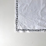 White cotton placemat with blue detail