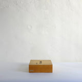 Wood box with Chinese characters.