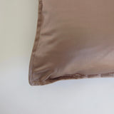 Muted pink satin cushion