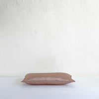 Muted pink satin cushion