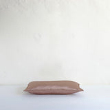 Muted pink satin cushion