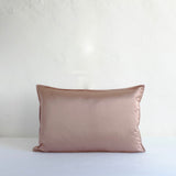 Muted pink satin cushion