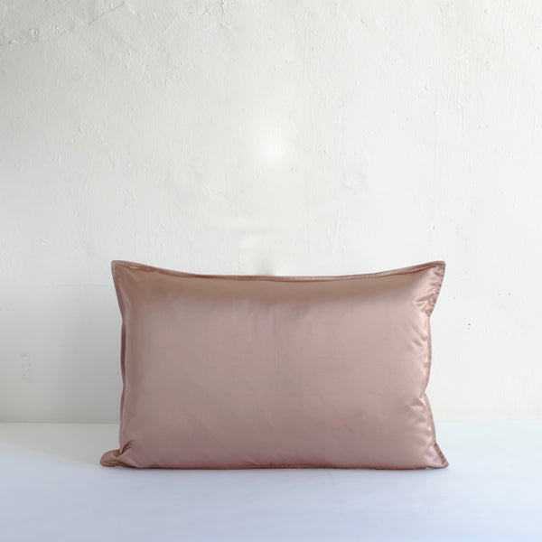 Muted pink satin cushion