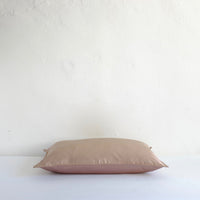 Muted pink satin cushion