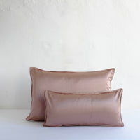 Muted pink satin cushion