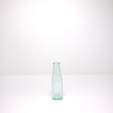 Green glass milk bottle
