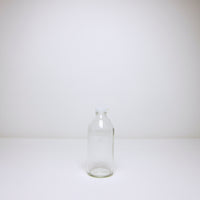 Milk bottle with plastic cap