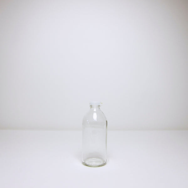 Milk bottle with plastic cap