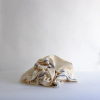 Natural linen with blue stripe throw