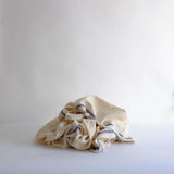 Natural linen with blue stripe throw