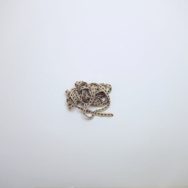 Natural cotton ribbon with red stitch