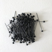 Black glass pins