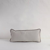 Pale grey piped cushion