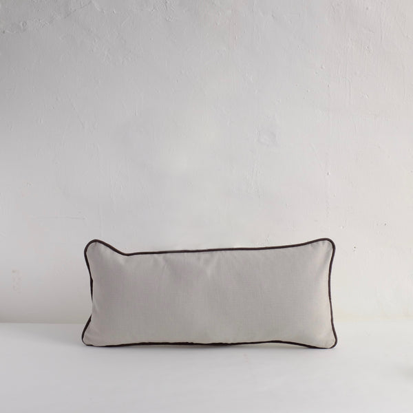 Pale grey piped cushion