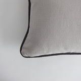 Pale grey piped cushion