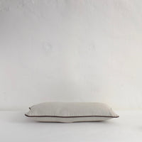 Pale grey piped cushion