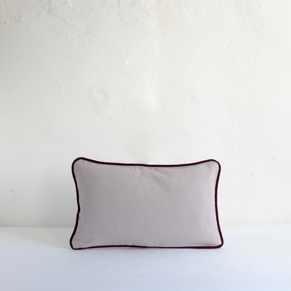 Pale grey cotton cushion with piping