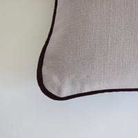 Pale grey cotton cushion with piping