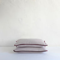 Pale grey cotton cushion with piping