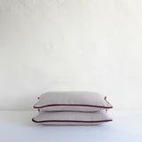 Pale grey cotton cushion with piping