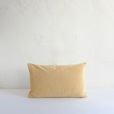Pale yellow velvet cushion