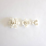Porcelain wall hung flowers