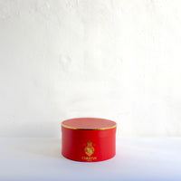Christy's red oval hat box